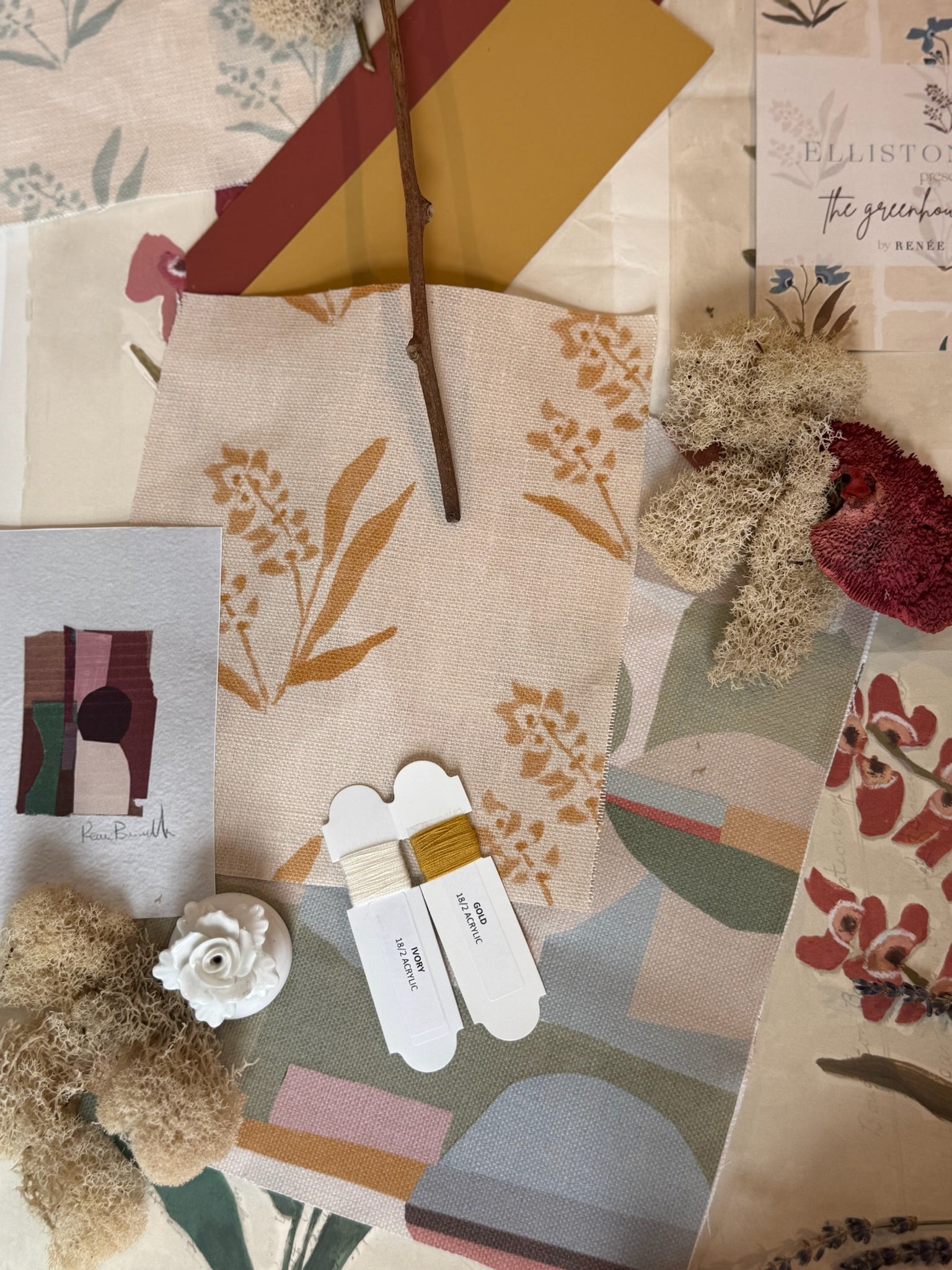 Marigold EH x Renee Bouchon Marbella linen fabric with botanical print, surrounded by coordinating swatches and threads.
