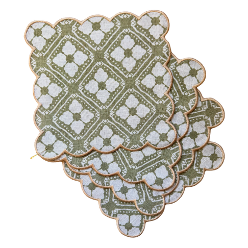 Set of four Echo Sage scalloped cocktail napkins with green and white floral pattern and pink trim.