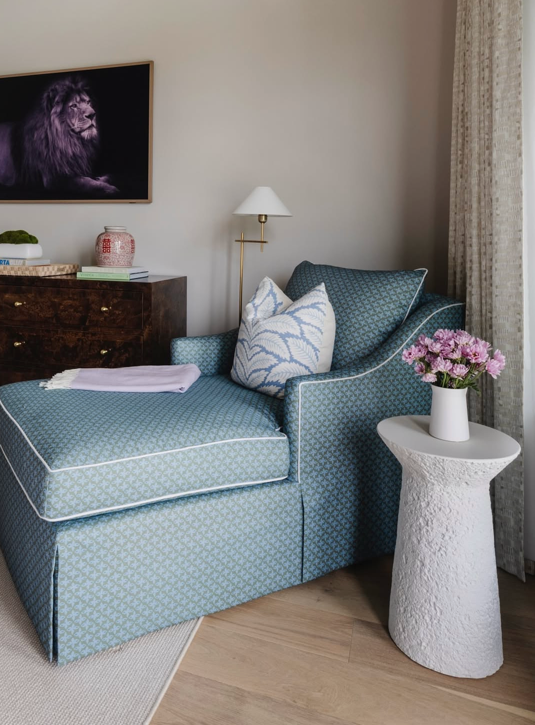 Posey Fabric - Moss: Teal linen-cotton blend chaise lounge with white piping and patterned throw pillow.