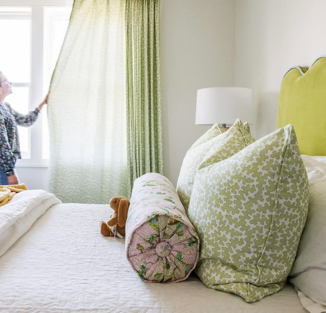Dover Fabric - Apple linen-cotton blend curtains and pillows with a subtle green pattern in a bedroom.