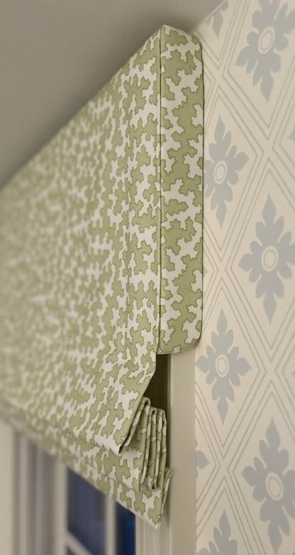 Dover Fabric in Apple, a green and white linen-cotton blend Roman shade with a geometric pattern.