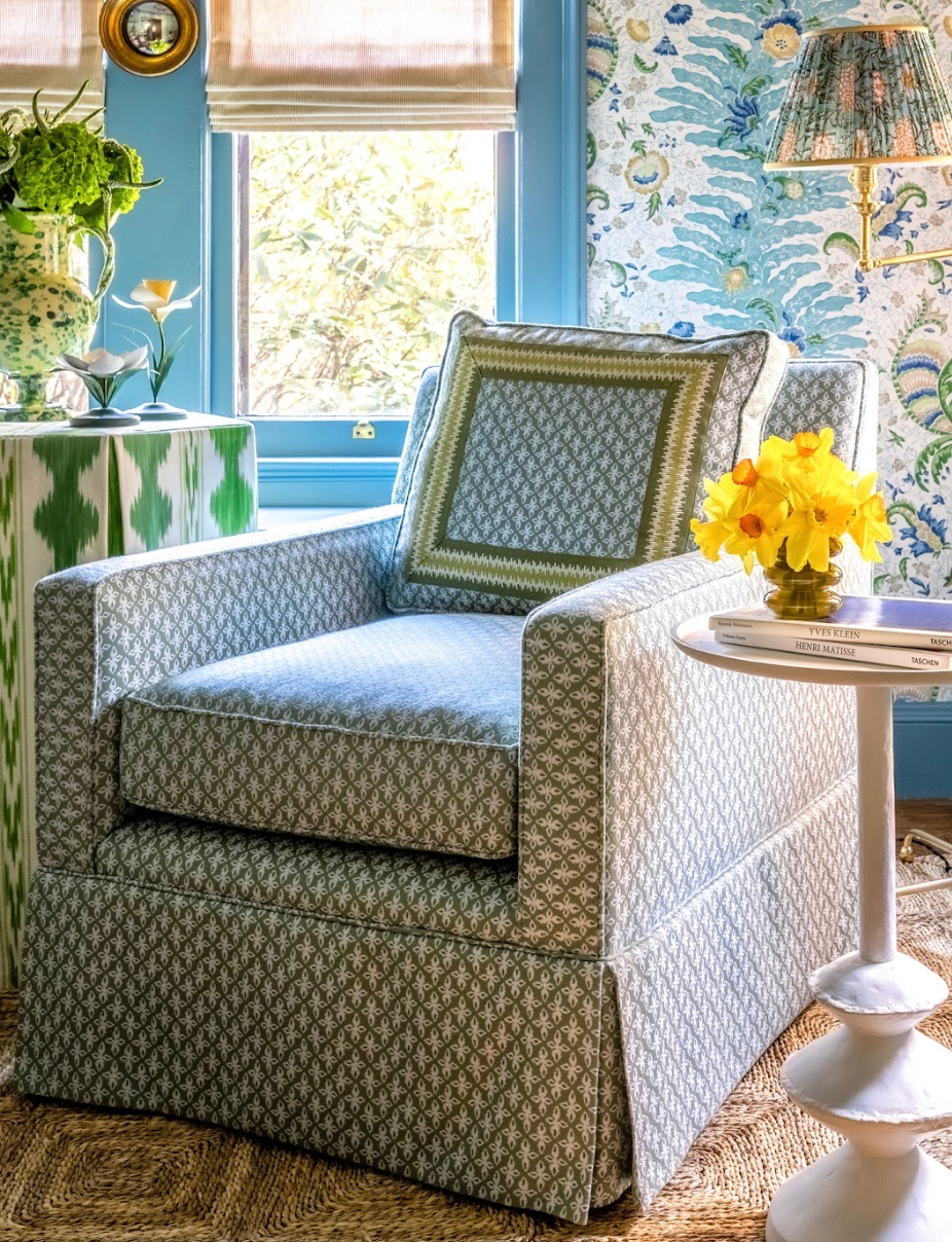 EH x Sunbrella Posey Fabric in Fern, a green patterned indoor-outdoor performance fabric on an armchair.