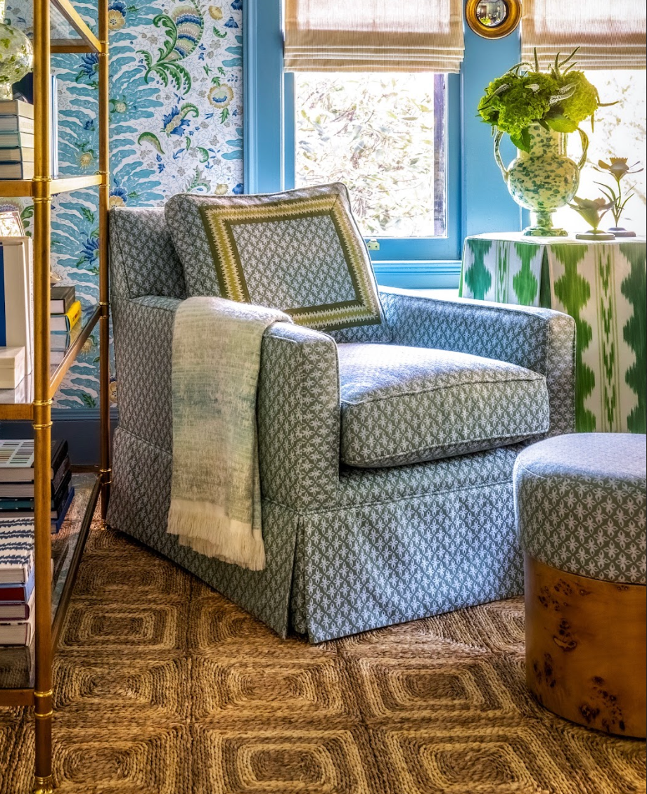 EH x Sunbrella Posey Fabric in Fern on an armchair, with a throw and patterned pillow.