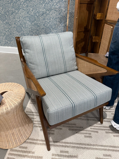 EH x Sunbrella Thorton Fabric in Surf, a blue and white striped performance fabric on a modern wooden chair.