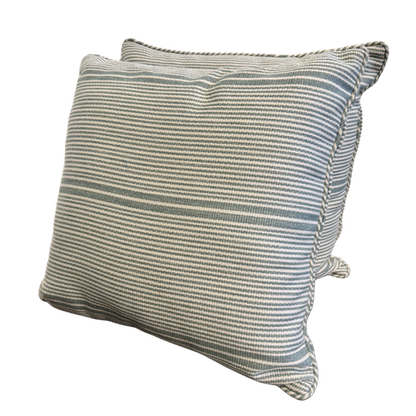 Pair of 18x18 EH x Sunbrella Thorton Surf indoor-outdoor pillows with blue and white stripes and self-welt trim.