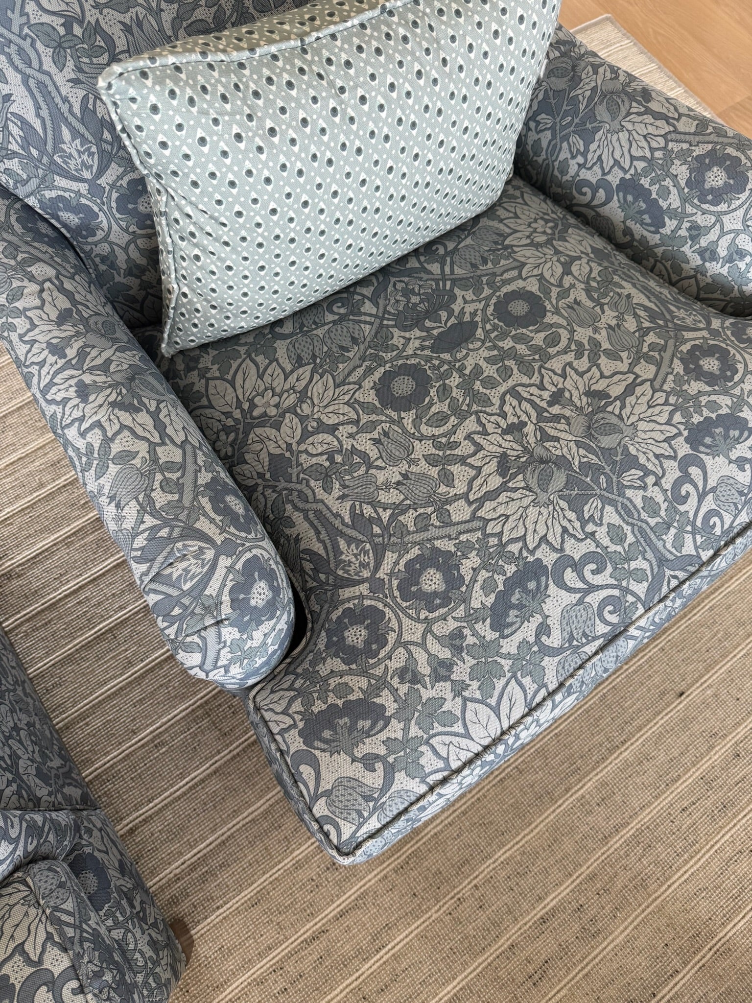 Cobalt Flora Fabric on a Belgian Oyster Linen armchair with a floral and botanical pattern.