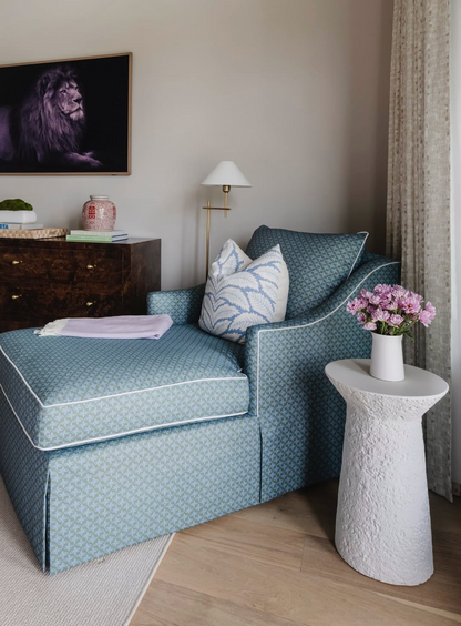 Posey Fabric - Moss: Teal linen-cotton blend chaise lounge with white piping and patterned throw pillow.