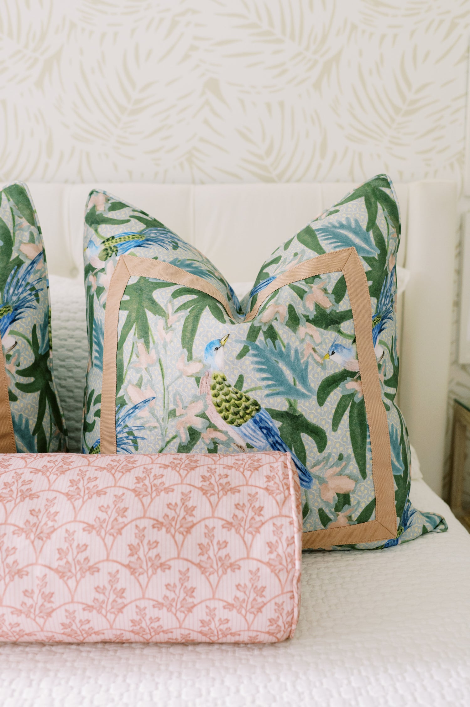Laurel Fabric - Poppy linen-cotton blend pillow with blue birds and green leaves, trimmed in tan.